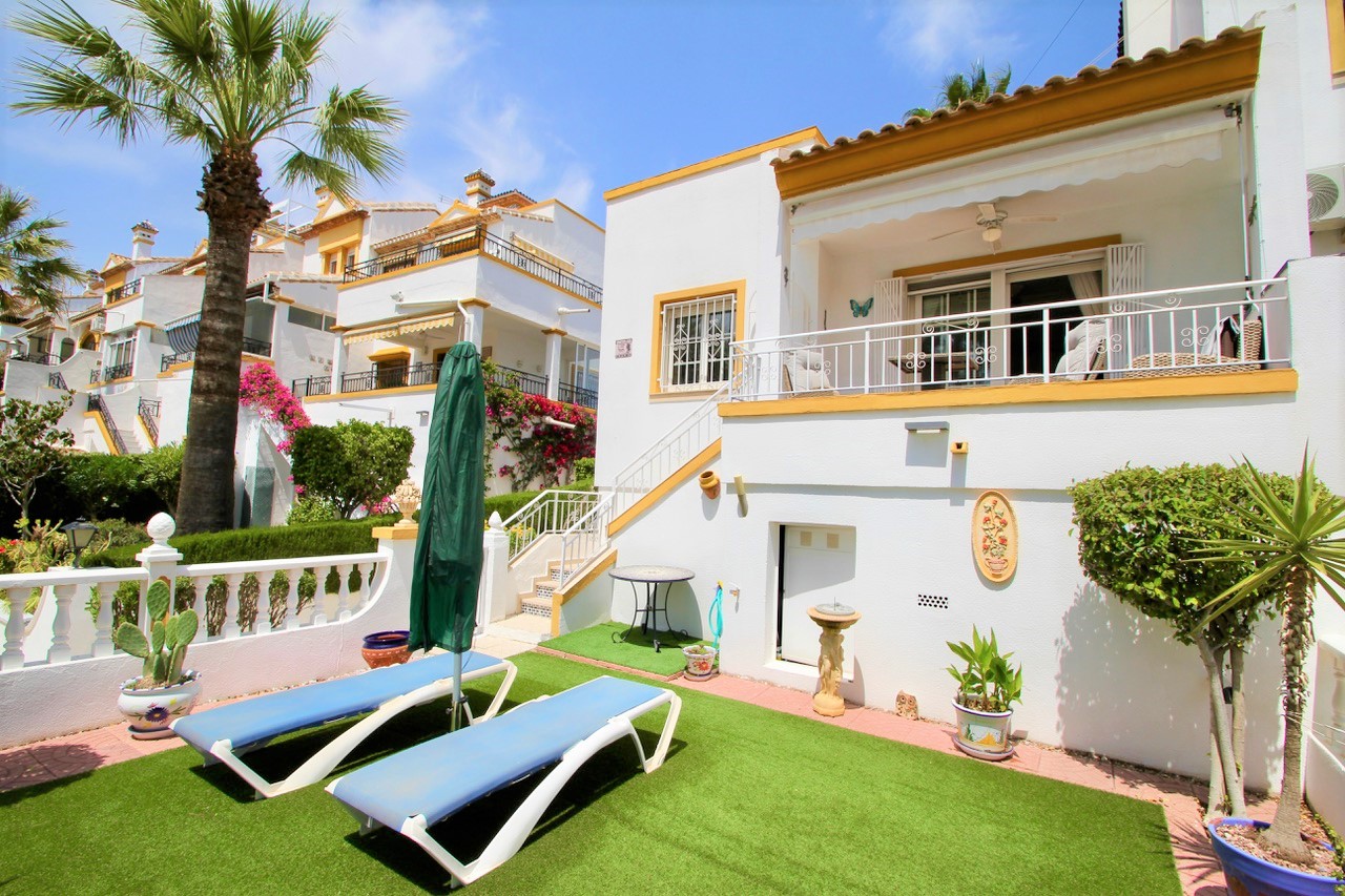 End of terraced villa with pool views in sought after location